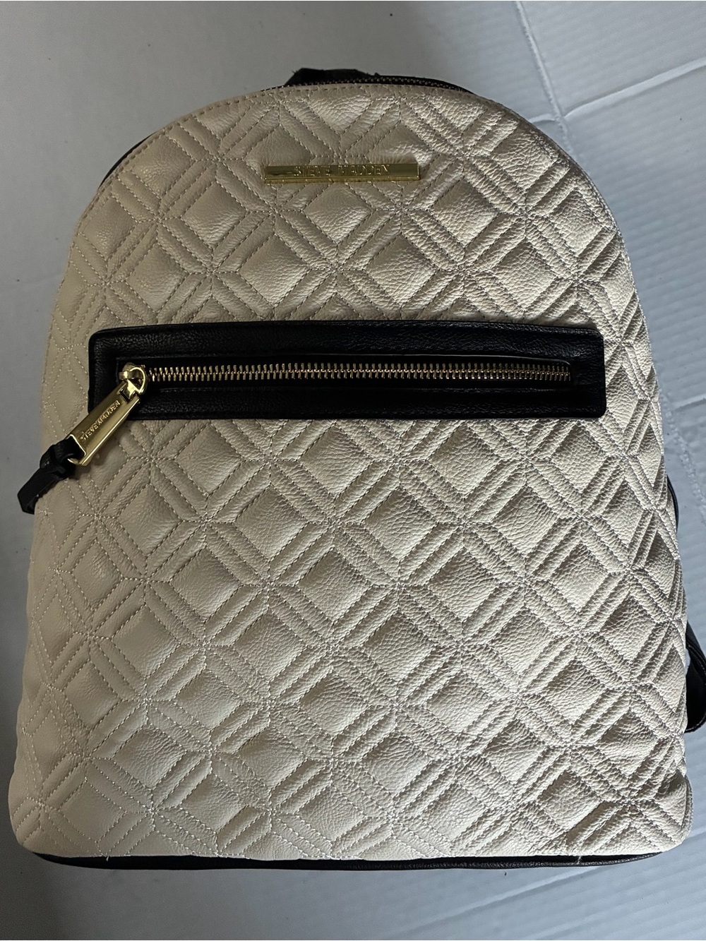 Steve Madden Quilted Cream Backpack with Black Trim and Gold Hardware